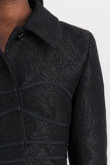Fitted black coat with asymmetric side panels